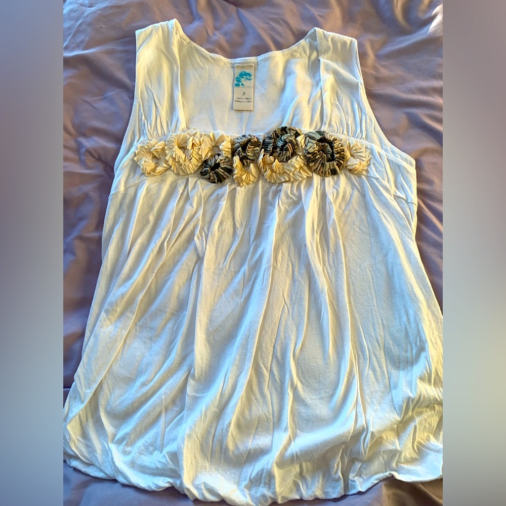 Cotton tank top with beautiful floral design at neckline.
